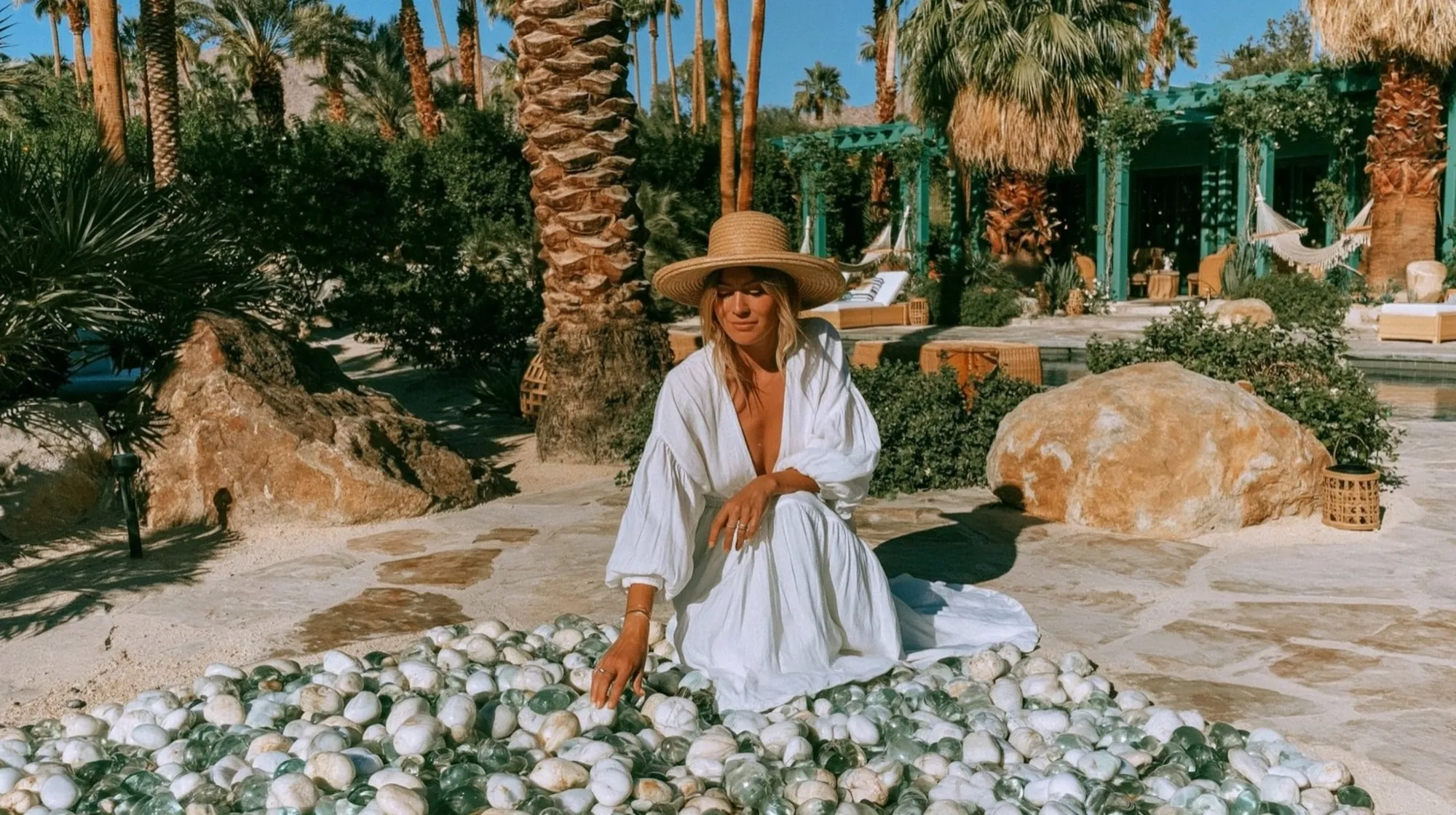 A customer hand-picking river stones at a desert resort
